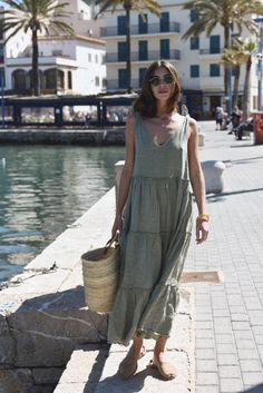 Style // A subtle, soothing and summer infused sage green linen maxi dress V-neck line and low back dress, The Sevilla Dress is a true goes-with-anything essential, guaranteed to turn heads in this timeless linen maxi dress with tie closures at the shoulders, and a tiered body for added dimension and versatility. With that perfect flowy and relaxed fit, the stunning Sevilla Dress was designed to be dressed up with a strappy sandal or barefoot for that effortlessly beautiful look! Fabric Note // Linen V-neck Sundress Maxi Dress, Linen Maxi Dress For Brunch, Chic Maxi Linen Dress For Brunch, Linen Chic Maxi Dress, Linen Sundress Maxi Dress For Brunch, Chic Linen Maxi Dress For Day Out, Chic Linen Maxi Dress For Summer, Maxi Linen Dress For Brunch, Maxi Length Linen Dress For Brunch