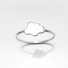 Handmade Sterling Silver Cloud Ring, A Beautiful Tiny Cumulus from the Sky to Wish you a Beautiful day. You can personalized the cloud with Engravable Initials option. ► DIMENSIONS: * Ring face size: 7mm X 10mm ◆ Average silver weight: 1.8 gr. ► PRODUCTION METHOD:  💓 Handmade with Love and Care 💓 ► MATERIALS: * Ethically sourced materials * High Quality High Quality Solid 925 Sterling Silver ► INTERNATIONAL SHIPPING:  * We use International Priority Shipping Service * 5-10 business days * Trac Silver Hypoallergenic Flower Ring, Delicate Handmade Silver Flower Ring, Cloud Ring Silver, Clouds Jewelry, Cloud Jewelry, Cloud Ring, Silver Cloud, Tiny Things, Initial Ring