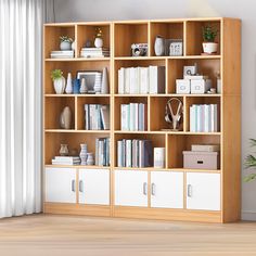 a wooden bookcase filled with lots of books next to a white wall and window