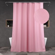 a bathroom with a pink shower curtain next to a white bathtub and window in the background