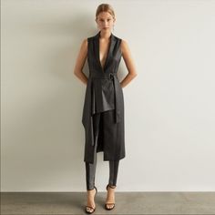 Nwt Bcbgmaxazria Faux Leather Drape Front Long Vest Size Xxs This Structured Long Vest In Supple Faux Leather Features A Classic Notched Lapel, Wide Waist Belt, And Chic Draped-Front Detail. Center Front Button Closure Sold Out / Retails For $368 Attached Adjustable Waist Belt With D-Ring Closure Patch Pockets Dry Clean Sleeveless Blazer Dress, Animal Print Vests, Wide Waist Belt, Open Front Vest, Velvet Vest, Sleeveless Blazer, Drape Jacket, Quilted Puffer Vest, Suede Vest