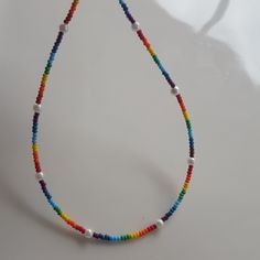 This tiny pearl Necklace I used rainbow core beads and glass pearls. Each Pearl chokers rainbow bead necklace has an extension chain of approximately 1 inch. I also used a stainless steel wire 24K Gold Plated Extension Chain 24K Gold Plated Lobster Claw on the seed bead necklace. This seed pearl seed bead rainbow necklace will be so perfect with all your everyday outfits. Tiny Seed Pearl Necklace, Tiny Pearl Necklace, Seed Pearl Necklace, Small Bead Necklace >Click on the link for Other pearl chokers,delicate necklace,dainty necklace,beachy necklaces,multi colored necklaces, beaded necklace. https://www.etsy.com/shop/dkSeedbead?ref=seller-platform-mcnav Small Bead Necklace, Bead Rainbow, Tiny Pearl Necklace, Beachy Necklace, Multi Coloured Necklaces, Rainbow Necklace, Rainbow Beads, Seed Bead Necklace, Seed Pearl