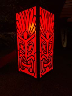 a red lantern with two faces on it