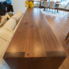 a wooden table sitting on top of a hard wood floor