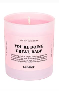 a pink candle that says you're doing great babe