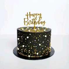 a black and gold birthday cake with sparkles