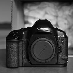 a black camera sitting on top of a table