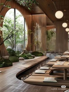 a restaurant with lots of wooden tables and plants