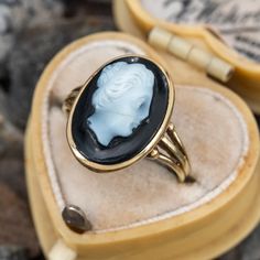 This pretty cameo ring is centered with a bezel set sard onyx cameo. The ring is crafted in 14k yellow gold and is currently a size 4.75. There is a hairline fracture in the cameo that has been expertly repaired. Cameo Rings For Sale, Luxury Vintage Cameo Ring, 14k Gold Cameo Rings For Collectors, Cameo 14k Gold Rings For Collectors, Collectible 14k Gold Cameo Rings, 14k Gold Oval Cameo Signet Ring, Oval Cameo Signet Ring In 14k Gold, 14k Gold Cameo Rings For Anniversary, Cameo 14k Gold Rings For Anniversary