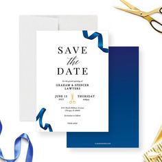 a blue and white save the date card next to scissors, ribbon and other items