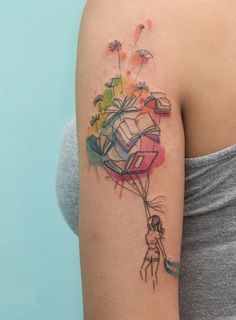 a woman with a colorful tattoo on her arm