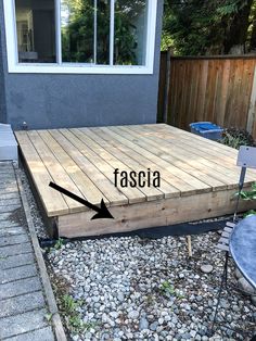 a wooden deck with the word fascia on it and an arrow pointing up