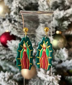 These earrings are an homage to our Virgen de Guadalupe, our Morenita. Available in three variations to honor our roots and Virgencita. Virgin Mary Earrings, Earring Inspo, Jewelry Earrings Studs, Favorite Jewelry, Handmade Items, Jewelry Earrings, Accessory Gift, Display Homes, United States