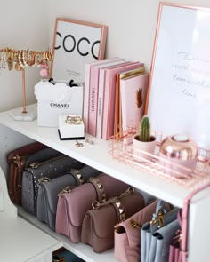 a white shelf filled with lots of purses