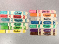 popsicles with name labels on them sitting on a table