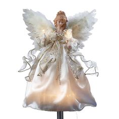 an angel figurine with white wings and gold trimmings on a stand