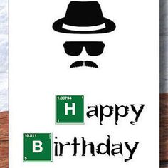 a greeting card with the words happy birthday and a hat on it, sitting next to a