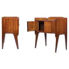 two wooden side tables with one open drawer and the other closed on both sides,