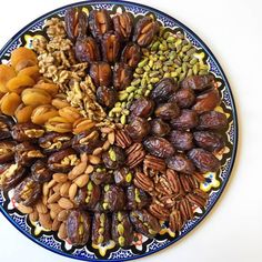 an assortment of nuts arranged in a circle on a plate