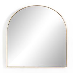 an arch shaped mirror on the wall