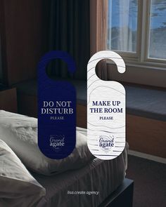 a door hanger that says don't disturb make up the room please in front of a bed