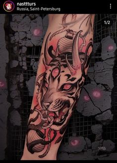 an arm with a tiger and snake tattoo on it's left leg, in front of a black background