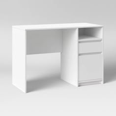 a white desk with an open drawer on the bottom and one drawer at the top