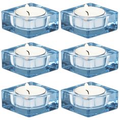 set of six blue glass candle holders with white candles