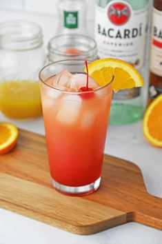 a drink with an orange slice on the rim