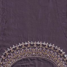 an embroidered purple cloth with gold trim