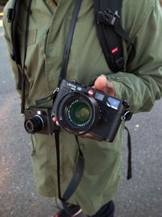 a man holding a camera in his hands