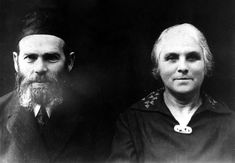 an old black and white photo of two men with long hair, one wearing a beard