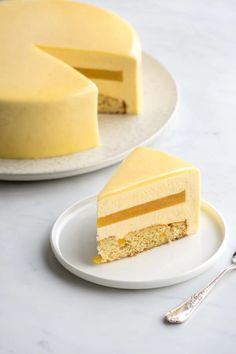 two plates with slices of cheesecake on them