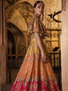 Luxury Mehndi Lehnga Choli for Wedding with Magnificent Look emblazoned with beautiful embroidery, dabka and sequins. This lehnga is unique in style and have classy look and perfect choice for traditional bride. Choli:Short Choli for bridal lehnga is yellow color is embellished with fully copper color embroidery, dabka, nakshi, stones, cutdana, crystals work. Neckline is decor with embroidery and with half sleeves. Fabric used for shirt is chiffon. Lehnga: Stylish Lehnga in three colosr is embel Mehndi Lehnga, Choli For Wedding, Mehndi Dresses, Raw Silk Lehenga, Bridal Lehenga Collection, Lehenga Collection, Pakistani Bridal Dresses, Indian Bridal Outfits, Wedding Dresses For Girls