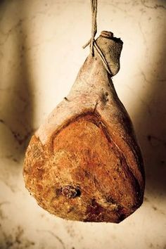 a piece of bread hanging from a rope