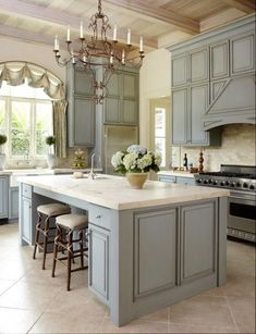 a large kitchen with an island in the middle