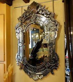 an ornate mirror hanging on the wall