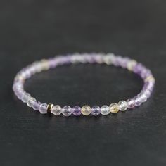 Ametrine: creativity, healing, clarity, soothing, alignment  Choose between: #1 Ametrine faceted round 4mm with 14K gold filled rondel #2 Ametrine smooth round 4mm with corrugated bead D E T A I L S △ Handmade in Canada △ Genuine Ametrine 4mm △ 14K gold filled rondel [optional] △14K gold filled corrugated [optional] △ Gemstones are 100% genuine  L E N G T H Please measure your wrist then add 1/2" to find your best fit. Select chosen size in the drop down menu. Please message me if you have any c Ametrine Bracelet, Ametrine Crystal, Ametrine Jewelry, Purple Crystal Bracelet, Crystal Purple, Gemstone Properties, Rishikesh, Women Bracelet, Purple Crystal