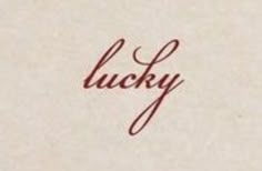 the word lucky written in cursive ink