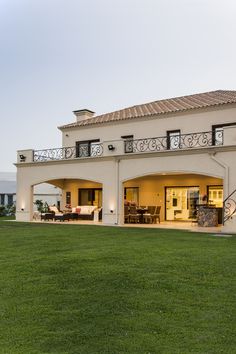 a large house with an open patio and balcony