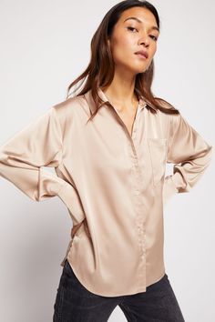 Bailey 44 Norea Blouse in Champagne - front 3/4 view Sleek Silk Top With Button Closure, Sleek Silk Button-up Top, Sleek Spring Shirt, Sleek Spring Blouse With Button Closure, Feminine Silk Button-up Top, Chic Silk Blouse With Shirttail Hem, Sleek Spring Tops For Daywear, Solid Color Silk Button-up Tops, Sleek Spring Daywear Tops