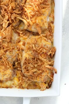 pork chops and hashbrown casserole in a white dish with text overlay