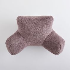 the pillow is shaped like a teddy bear