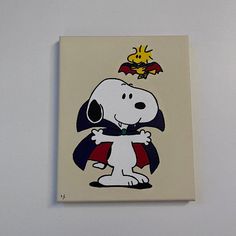 a painting of a dog with a cape on it's head