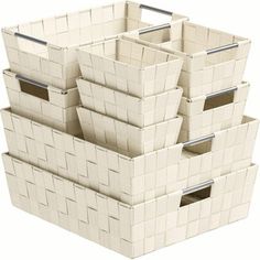 four white baskets stacked on top of each other