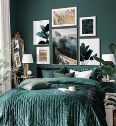 a bedroom with green walls and pictures on the wall above it, along with a bed