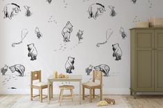 a child's playroom with winnie the pooh wall decals and toys