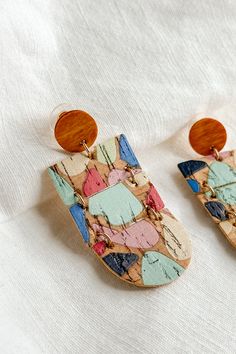 Close up view of the Wrenly Cork Multi Dangle Earring which features cork dangle earrings with multi color spots design Paint Cork, Cork Earrings, Cork Material, Hair Fragrance, Dress Jewelry, Diy Painting, Set Dress, Jewelry Sales, Jewelry Shop