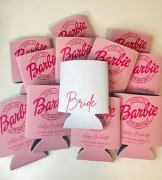 a bunch of pink bachelor party favors with the word bride on them and white paper