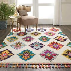 a living room with a chair and rug on the floor